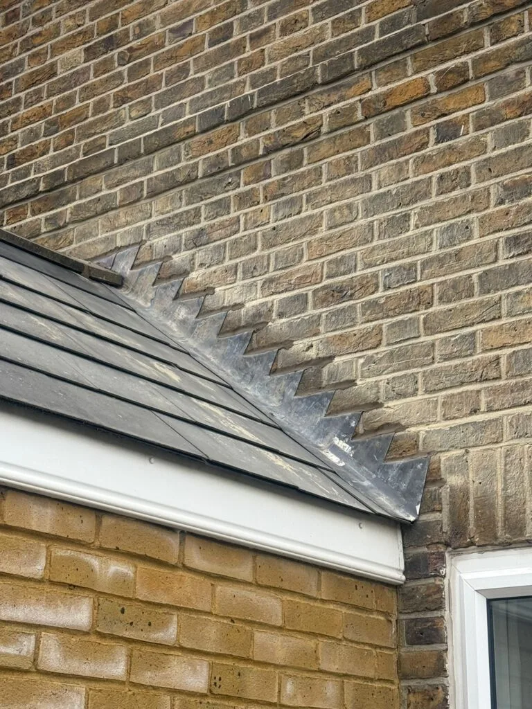 the joining of the shorter roof to the wall of the higher roof (this is the new lead flashing was put)