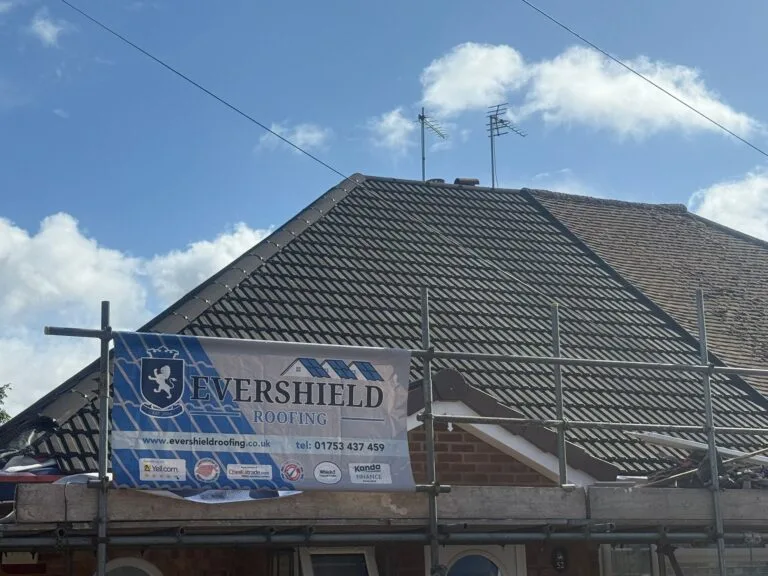 Evershield Roofing sign next to the newly installed roof